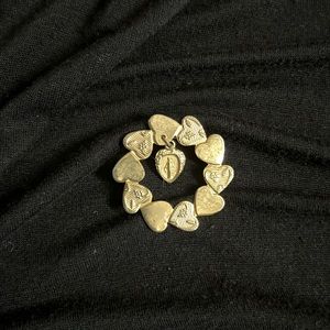 Beautiful pin with hearts and Virgin Mary charm.